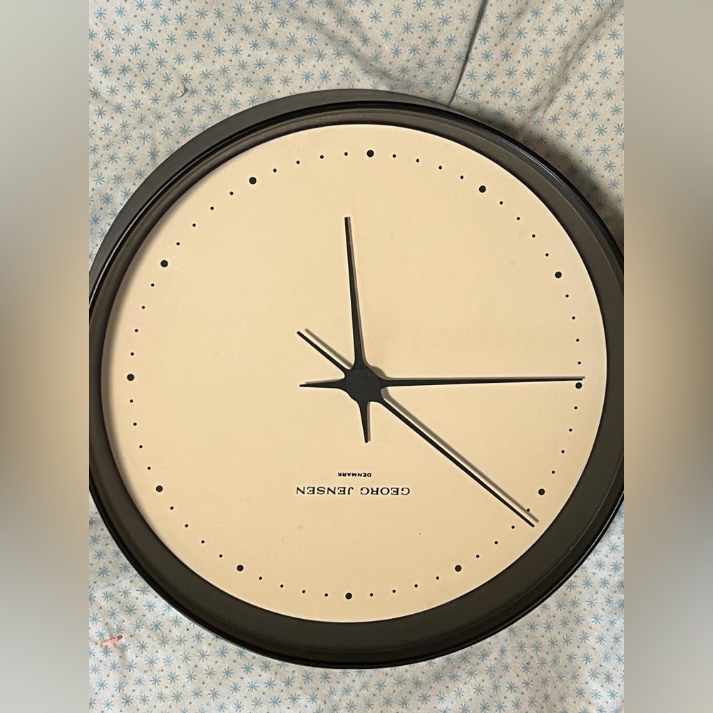 Designer wall clock. Designed by Henning Koppel